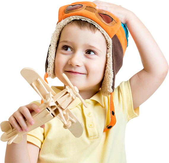 kid with wooden airplane toy